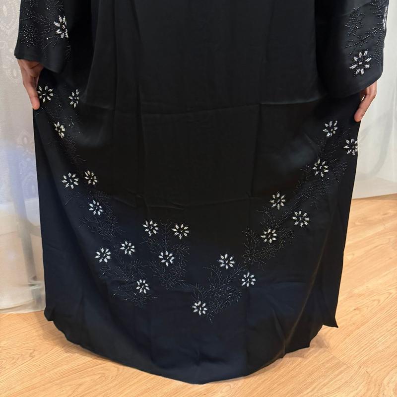 The Hadiqa Abaya - a black satiny 'Dubai' Abaya with black and hand sewn silver bead work in a flower pattern pattern and includes a chiffon hijab. 6