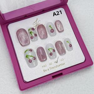 Hand-painted cherry nail art with cat-eye nails is versatile and reusable. Press on nails press  nails short  press  nails