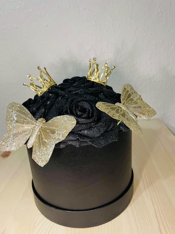 Artificial small black and gold glittered hat box arrangement with roses small crown and gold butterflies bespoke arrangement 0
