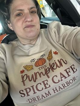 Product Review of The Pumpkin Spice Café Official Embroidered Crew Neck Sweatshirt - A warm beige super-soft sweatshirt with embroidered details (a collegiate style centre slogan, a pumpkin & autumn leaves). Boxy fit, crew neckline, cuffed sleeves and bottom hem. from K**e 0