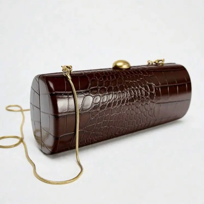 Elongated Box Bag In Burgundy With Faux Leather Embossed Pattern Exterior, Contrasting Chain Strap, Interior Lining And Metal Button Closure - Stylish And Functional For Parties, Weddings, Valentine's Day, Year-End Parties And Other Special Occasions, Bag
