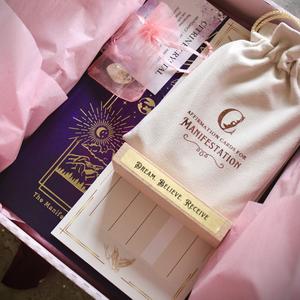 The Manifestation Box (contains a manifestation journal & guidebook, a 30 card deck of manifestation affirmation cards, velvet storage pouch, affirmation card stand, manifestation cheque & a citrine crystal)