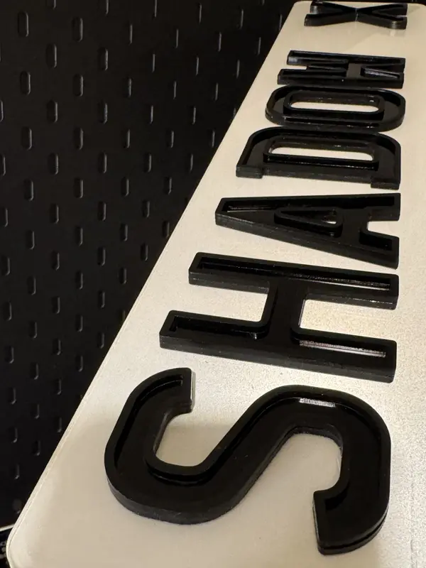 Shadow X raised with matte outline Display Signage 1
