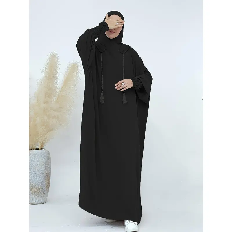 A Plain, Loose-Fitting Hooded Long Tunic for Ramadan, Featuring Elegant Batwing Sleeves, Designed for Women. 4