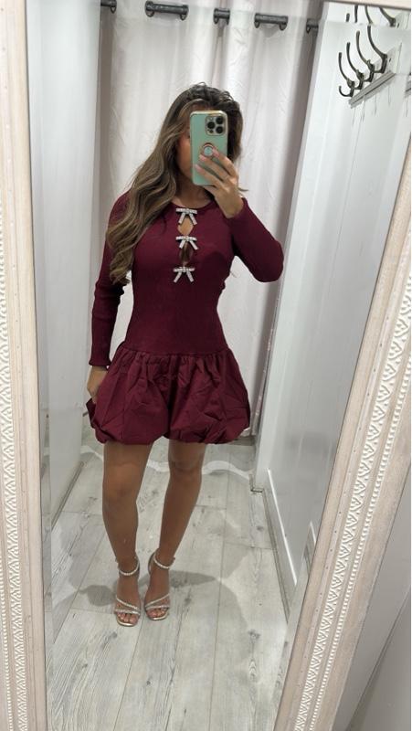 Women’s wine puff dress with bow detail and ruffled hem, stylish minimalist style.