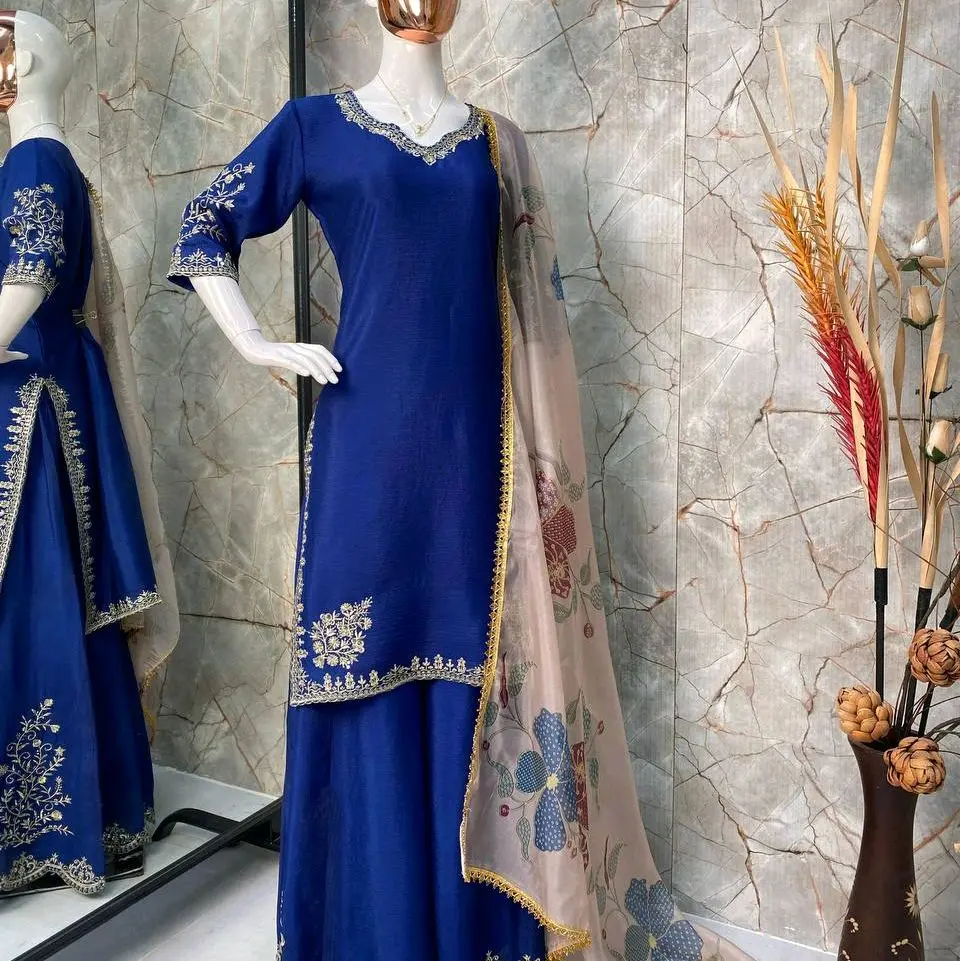 beautiful unique colour sharara set , with printed organza  duppatta,  adorned with golden  sequence embroidery. available in two colours.royal blue 38, red 40+
