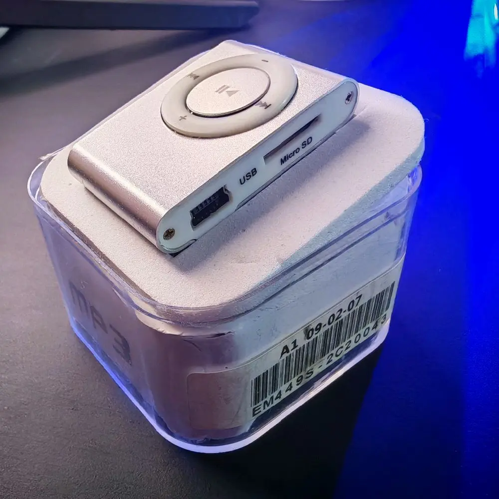 mini mp3 player with 4gb micro sd card silver fully boxed, earpiece,usb charger and manual. Audio Headphone