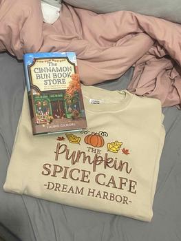 Product Review of The Pumpkin Spice Café Official Embroidered Crew Neck Sweatshirt - A warm beige super-soft sweatshirt with embroidered details (a collegiate style centre slogan, a pumpkin & autumn leaves). Boxy fit, crew neckline, cuffed sleeves and bottom hem. from T** B**k 📚** G**r ** 0