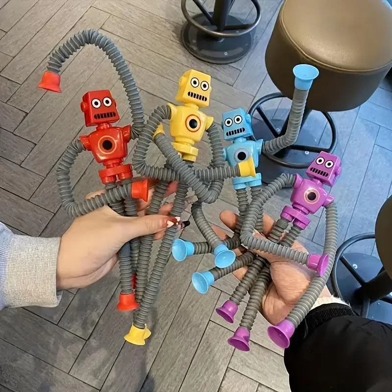 A Set of 12 Elastic Robot Toys with Suction Cups, Available in Four Colors, Perfect for Stress Relief Or As Decorative Items for The Home, Making Them a Great Gift. 2