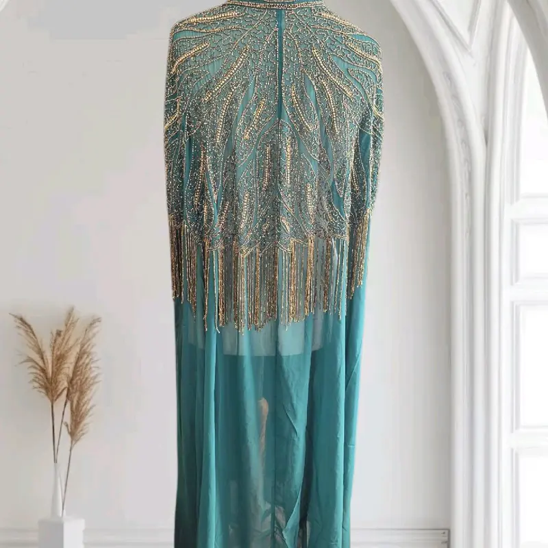 Step into elegance with our hand-embroidered kaftan! Each stitch is a masterpiece, blending tradition with modern flair. Perfect for any occasion, this luxurious piece adds effortless style to your wardrobe.  #HandEmbroidered #KaftanStyle #FashionGoa 3