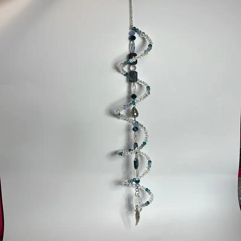 Beautiful, handmade sun catcher can be hung indoors or outside. Made with stainless steel metal and glass , approx. 12” various colours