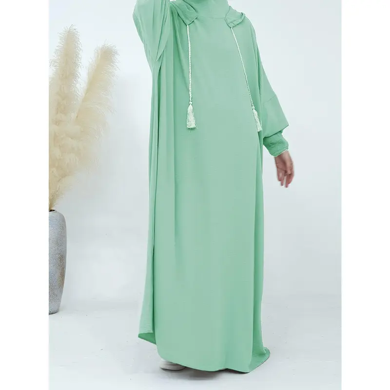 A Plain, Loose-Fitting Hooded Long Tunic for Ramadan, Featuring Elegant Batwing Sleeves, Designed for Women. 3