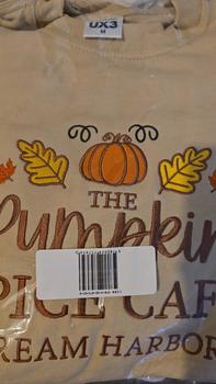 Product Review of The Pumpkin Spice Café Official Embroidered Crew Neck Sweatshirt - A warm beige super-soft sweatshirt with embroidered details (a collegiate style centre slogan, a pumpkin & autumn leaves). Boxy fit, crew neckline, cuffed sleeves and bottom hem. from T**a F**r 0