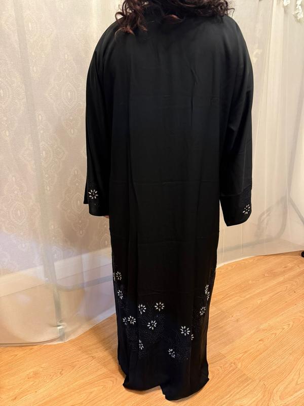 The Hadiqa Abaya - a black satiny 'Dubai' Abaya with black and hand sewn silver bead work in a flower pattern pattern and includes a chiffon hijab. 5