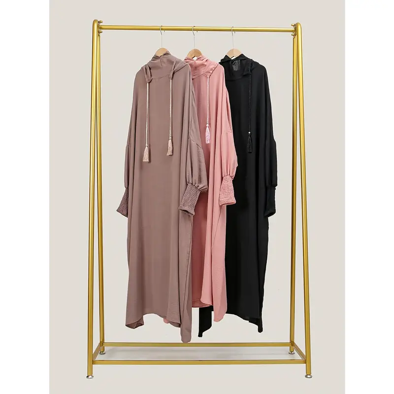 A Plain, Loose-Fitting Hooded Long Tunic for Ramadan, Featuring Elegant Batwing Sleeves, Designed for Women. 8