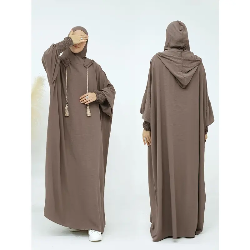 A Plain, Loose-Fitting Hooded Long Tunic for Ramadan, Featuring Elegant Batwing Sleeves, Designed for Women. 6