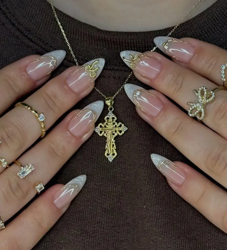 Handmade Soft Gel French Tips – Long-Lasting Reusable Luxury Milky White Marble Nails with Gold Bow Charms & Elegant Stiletto Design 1