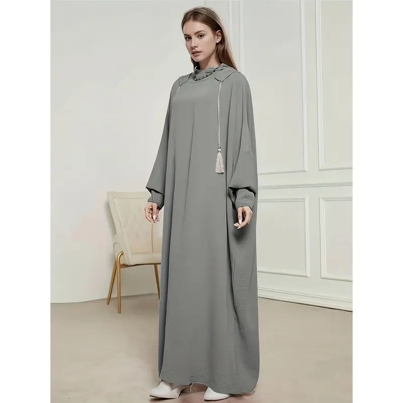 A Plain, Loose-Fitting Hooded Long Tunic for Ramadan, Featuring Elegant Batwing Sleeves, Designed for Women. 1