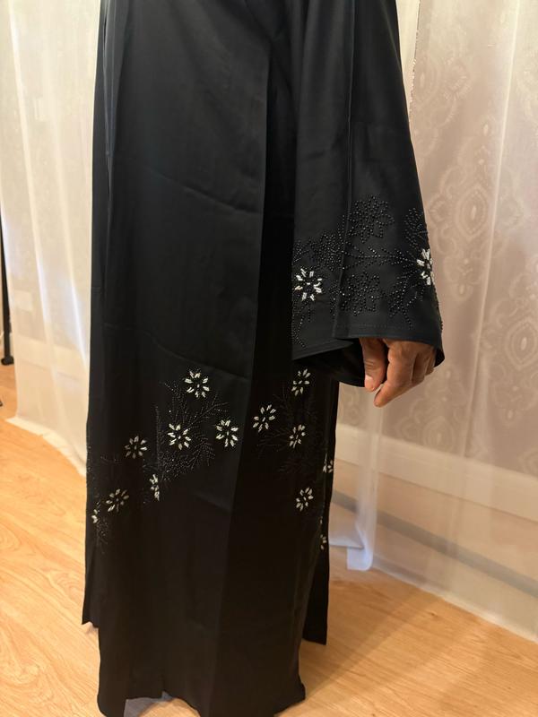 The Hadiqa Abaya - a black satiny 'Dubai' Abaya with black and hand sewn silver bead work in a flower pattern pattern and includes a chiffon hijab. 4