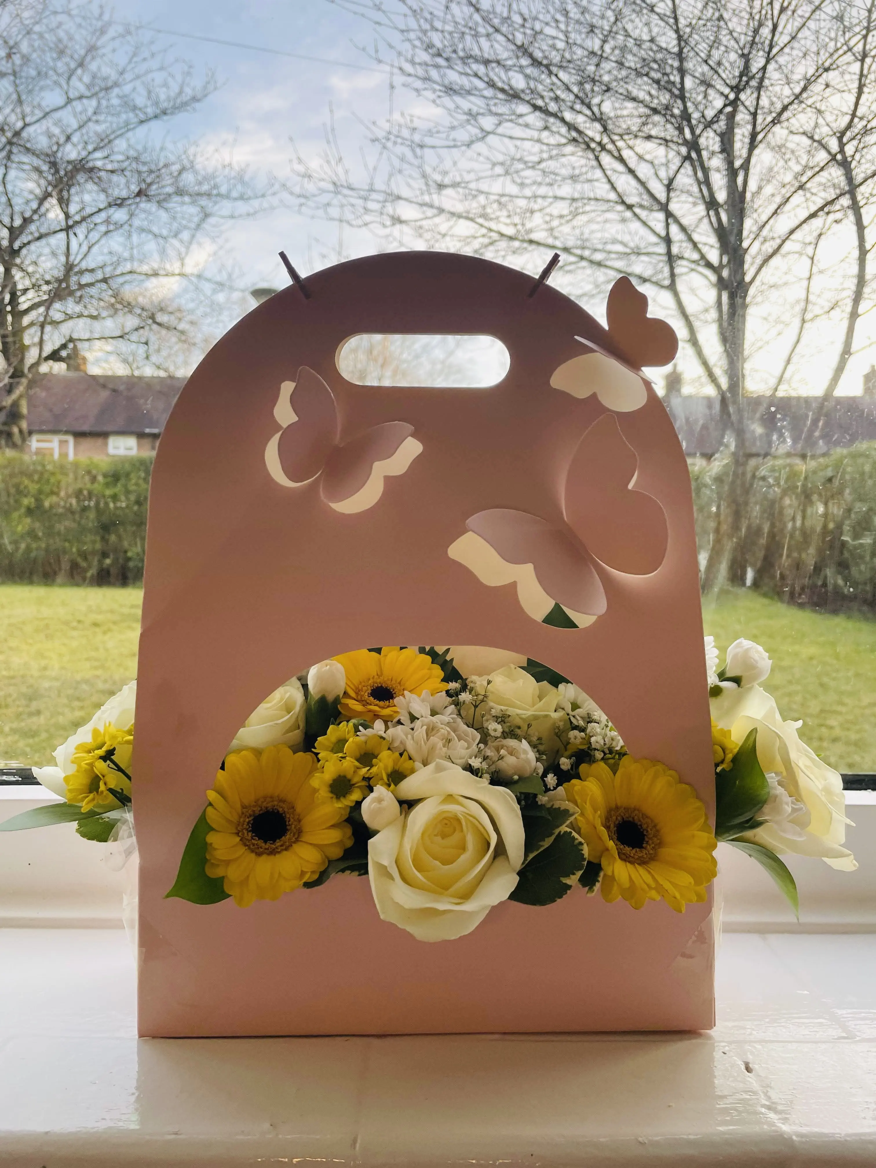 Fresh flowers arrangement in a 3D butterfly carrier makes a perfect gift for a loved one